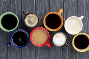 top-view-coffee-cups-wooden-table